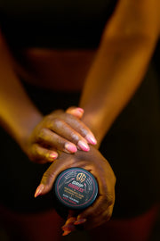Grip Goddess jars displayed on branded boxes